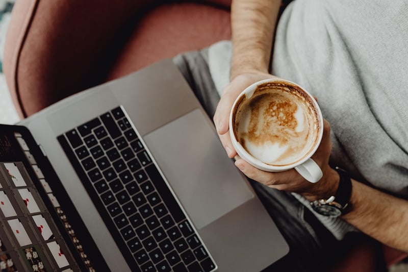 Businesswoman with laptop and coffee cup